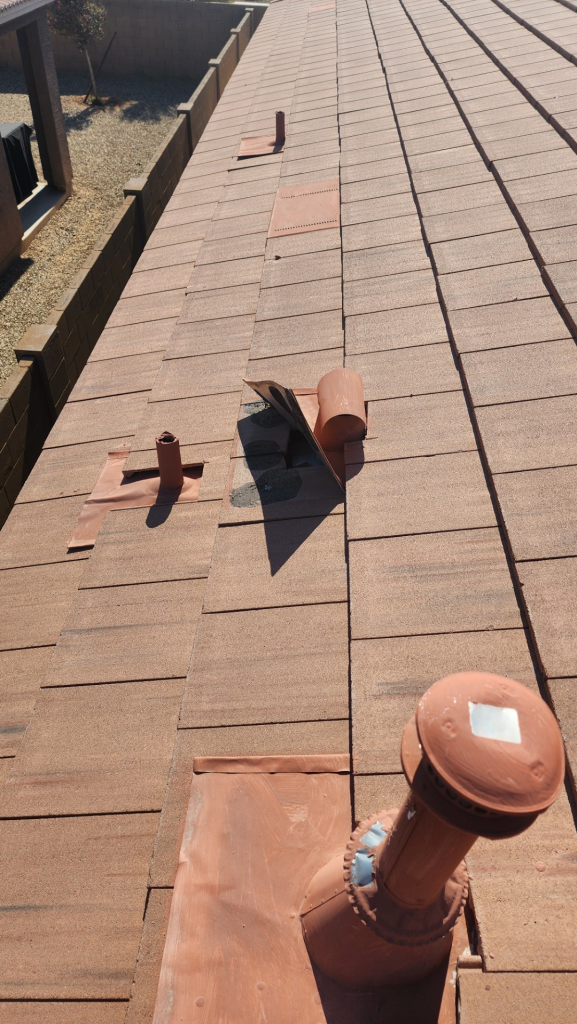Roof flashing failure causing tile roof leak around roof vent