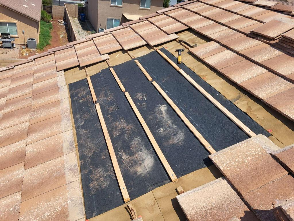 tile roof repair in Phoenix Arizona with underlayment exposed